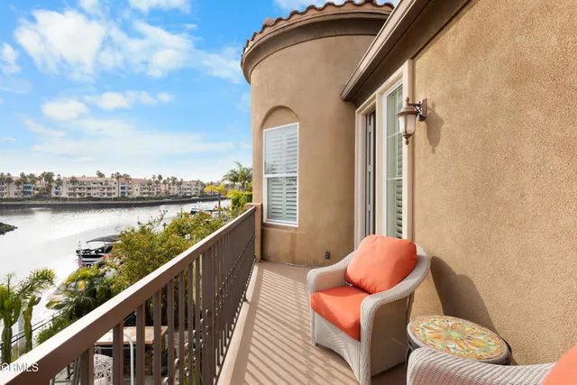 a view of balcony with furniture