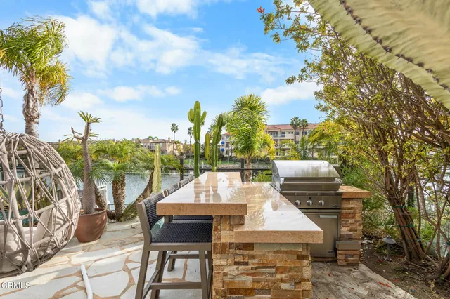 a view of a chairs and table in the patio