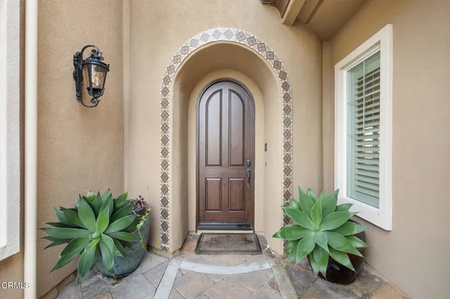 an aerial view of a house with outdoor space and a lake view