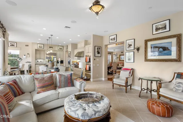 a living room with furniture and a rug
