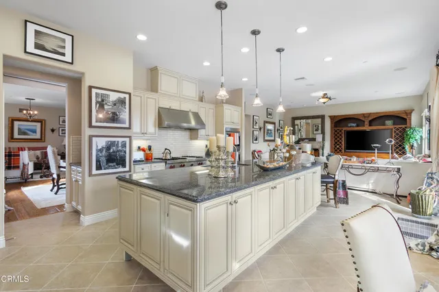 a kitchen with stainless steel appliances granite countertop a sink and cabinets