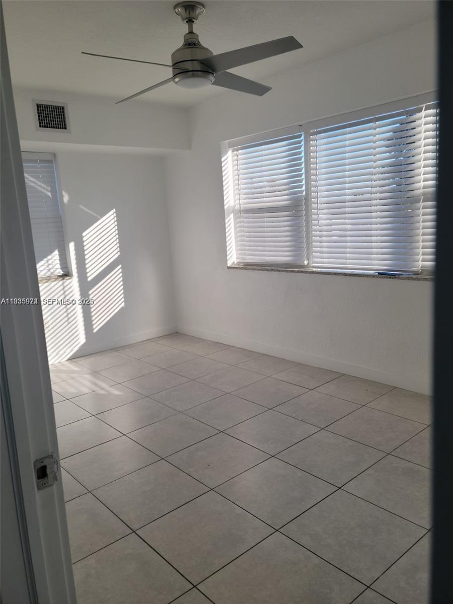 5655 Johnson Street, Unit 2 Hollywood, FL 33021 - Photo 3 of 8 a view of an empty room with a window