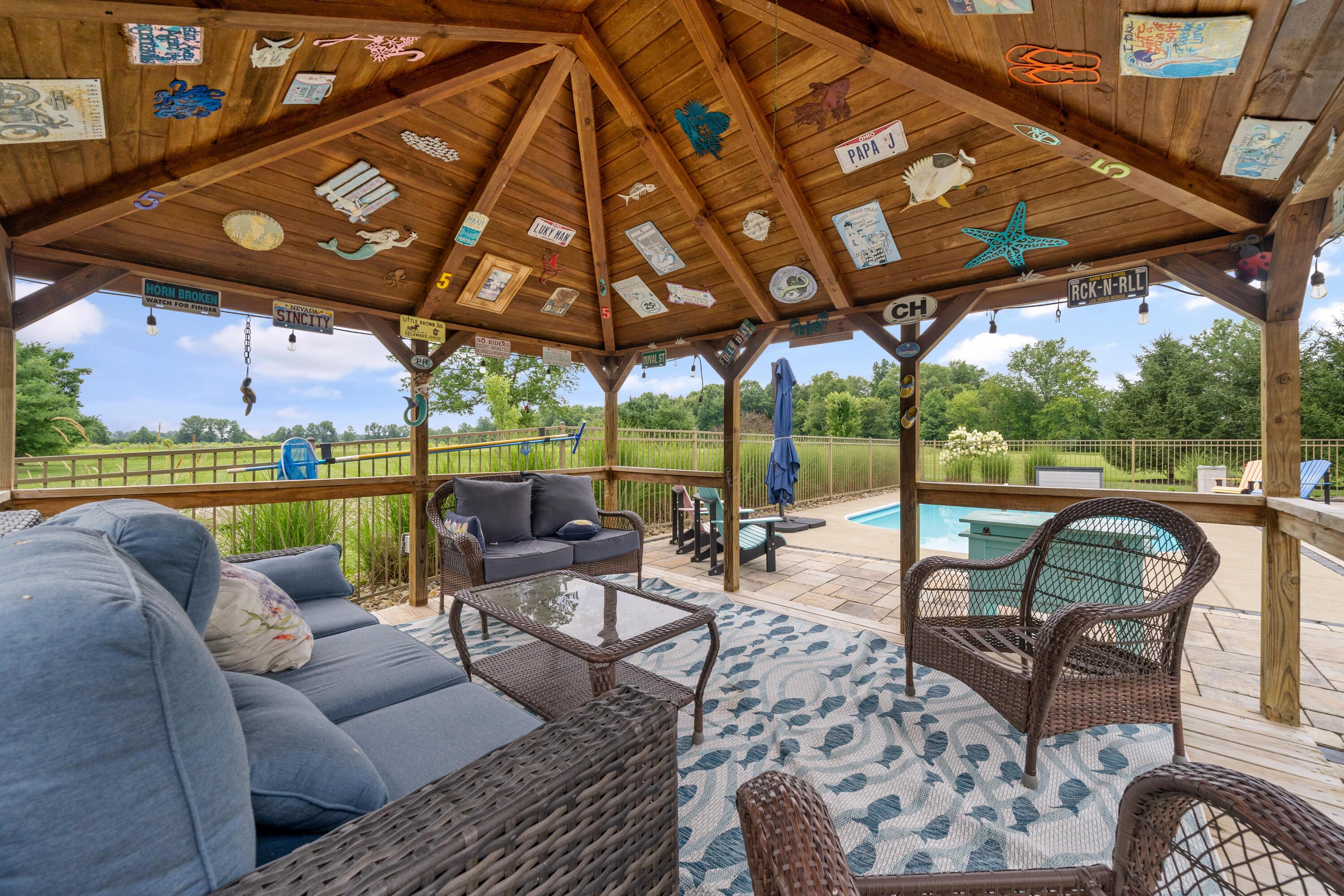 4640 Maynard Road Delaware, OH 43015 - Photo 73 of 91 Expansive wooden gazebo featuring a wood ceiling, string lighting, and a deck
