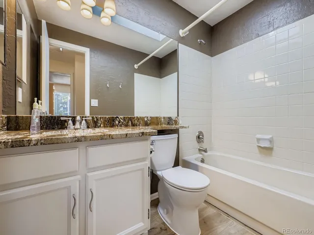 a bathroom with a toilet a sink and a bathtub