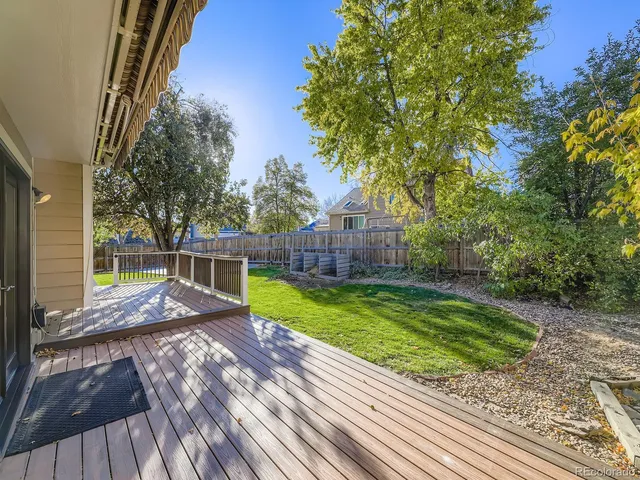 a view of a backyard with wooden floor