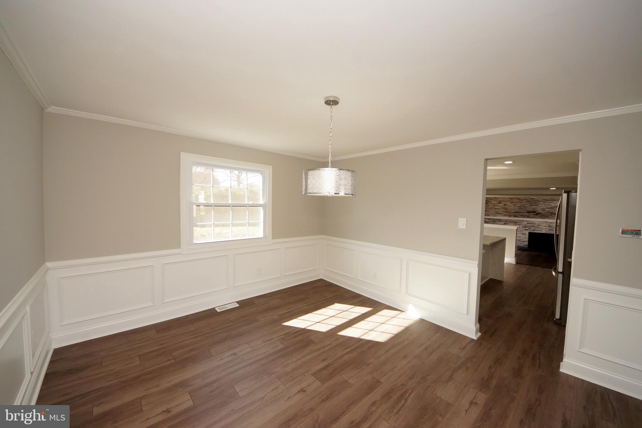 109 Coopers Kill Road Delran, NJ 08075 - Photo 11 of 35 an empty room with wooden floor and windows
