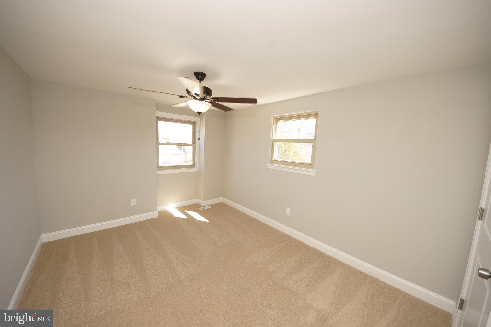 109 Coopers Kill Road Delran, NJ 08075 - Photo 23 of 35 an empty room with windows and chandelier fan