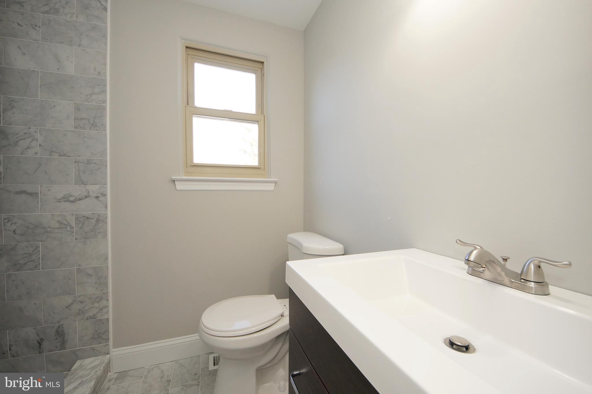 109 Coopers Kill Road Delran, NJ 08075 - Photo 28 of 35 a bathroom with a sink a toilet and window