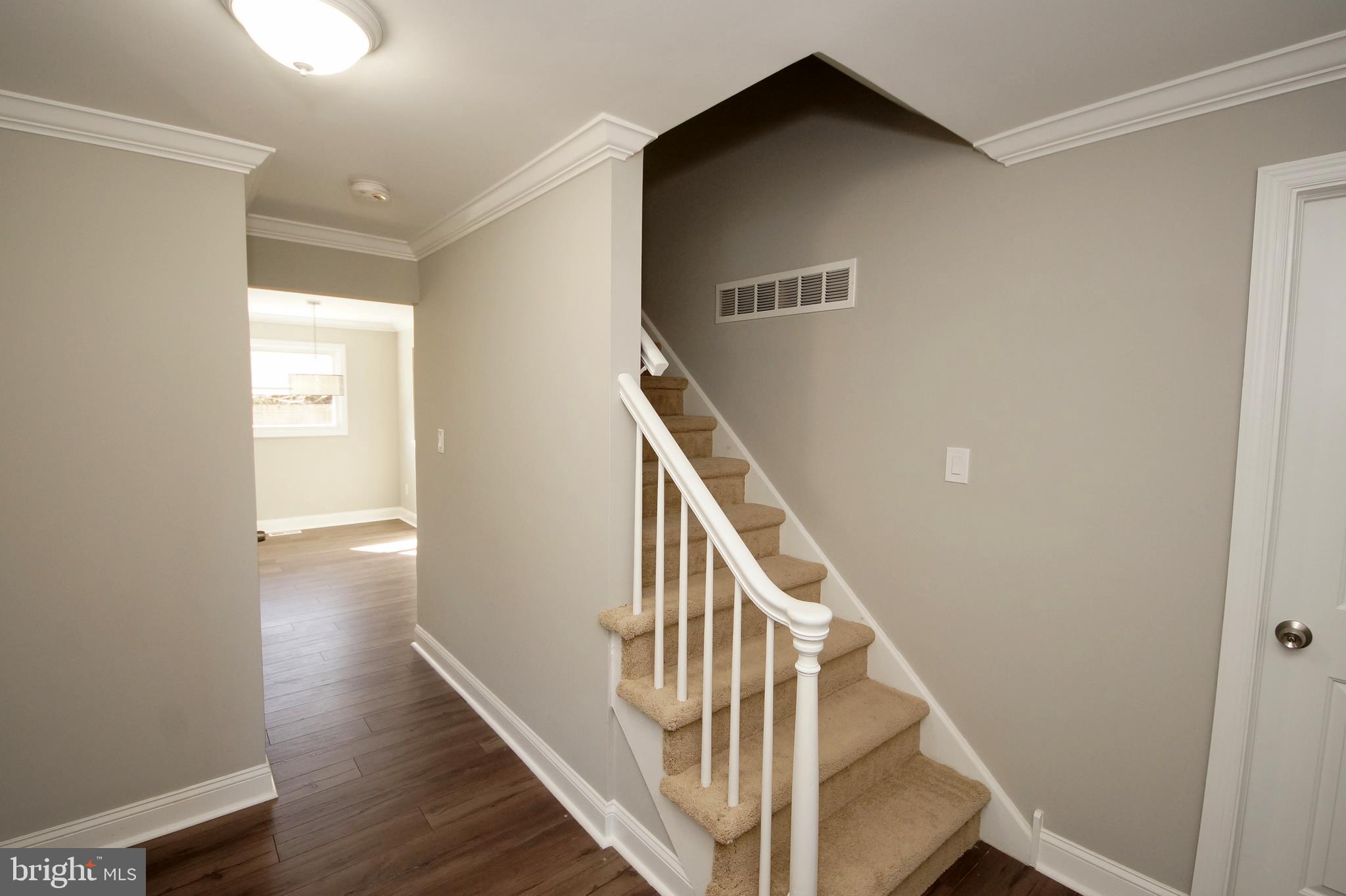 109 Coopers Kill Road Delran, NJ 08075 - Photo 4 of 35 a view of a hallway with wooden floor and stairs
