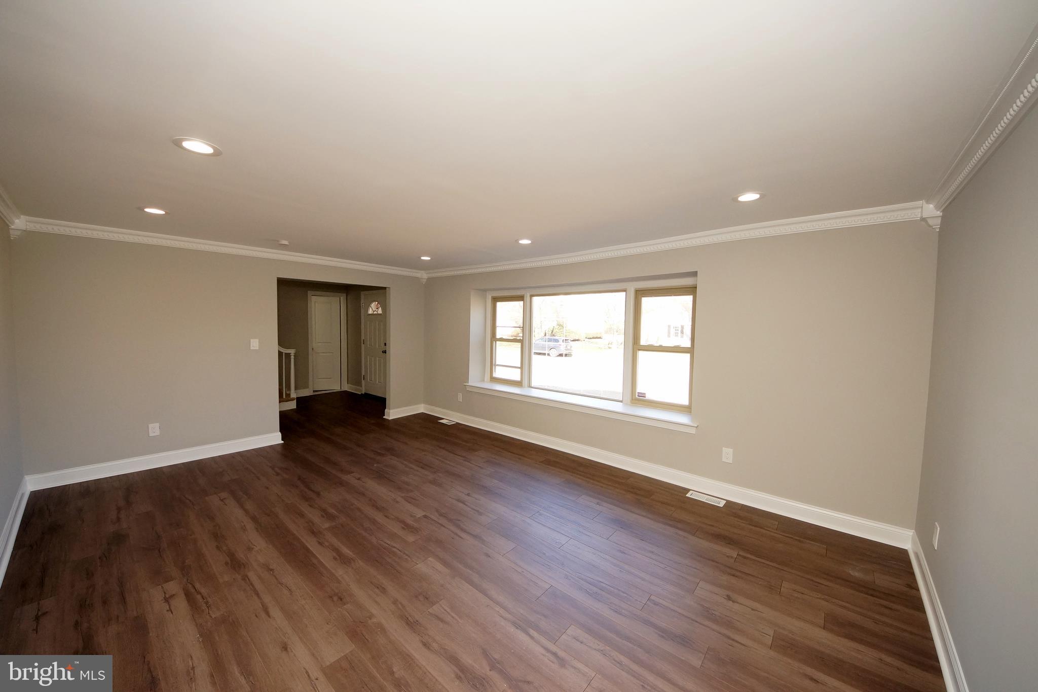 109 Coopers Kill Road Delran, NJ 08075 - Photo 6 of 35 a view of an empty room with wooden floor and a window