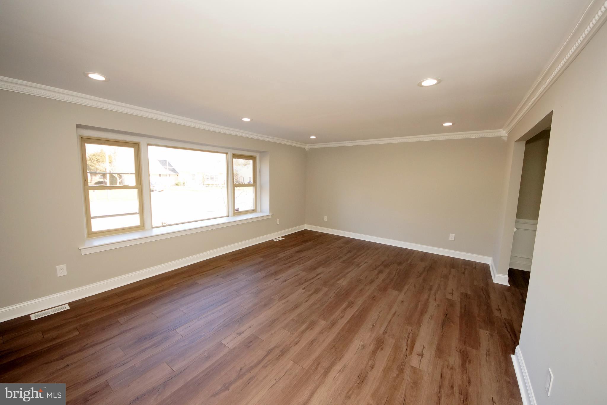 109 Coopers Kill Road Delran, NJ 08075 - Photo 7 of 35 an empty room with wooden floor and windows