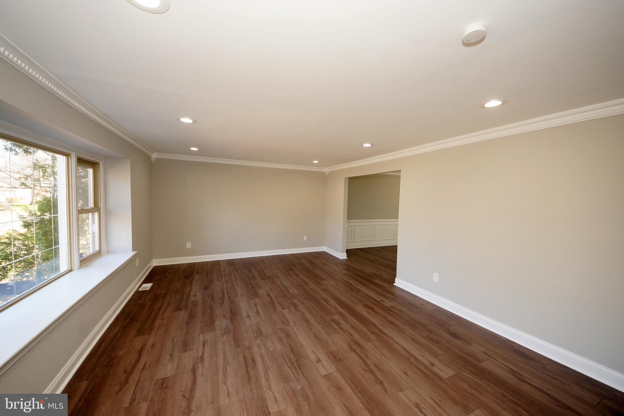 109 Coopers Kill Road Delran, NJ 08075 - Photo 8 of 35 a view of an empty room with wooden floor and a window