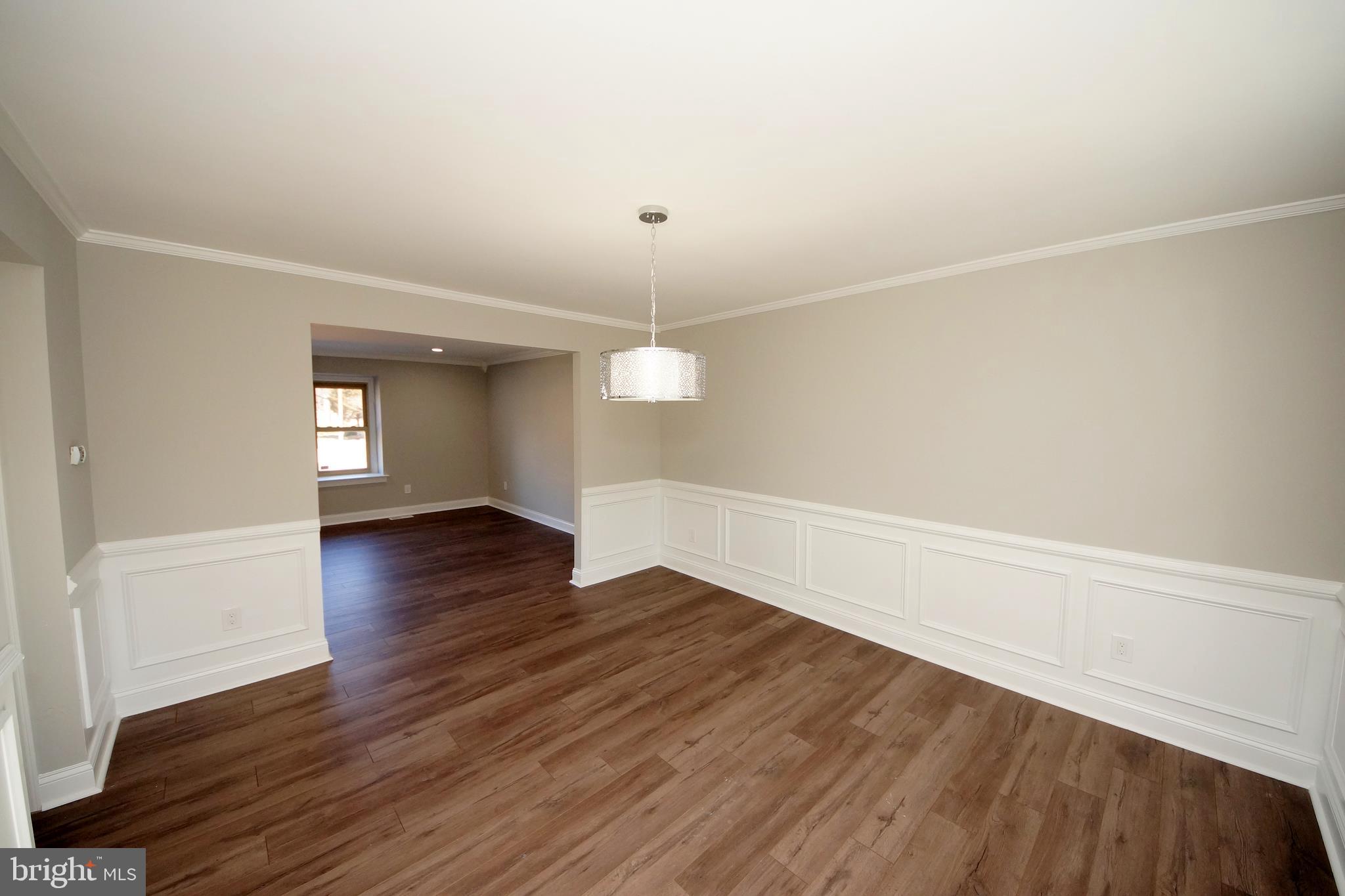 109 Coopers Kill Road Delran, NJ 08075 - Photo 9 of 35 an empty room with wooden floor and windows