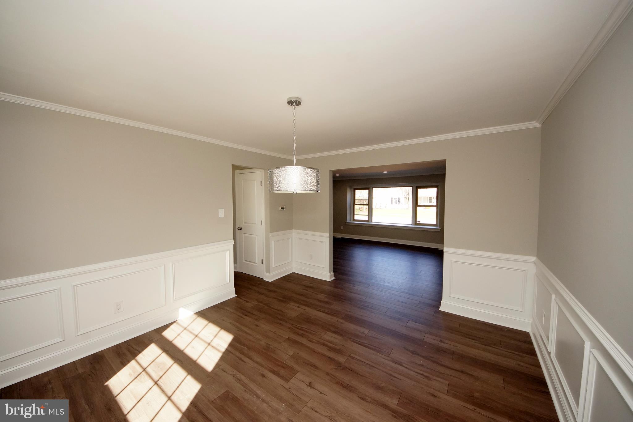109 Coopers Kill Road Delran, NJ 08075 - Photo 10 of 35 an empty room with wooden floor and windows