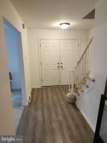 a view of entryway with wooden floor