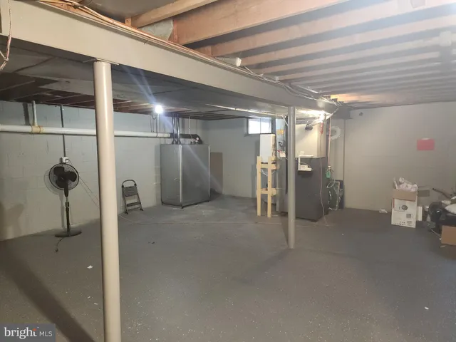 a view of room with wooden floor