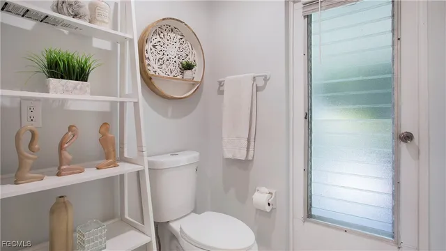 a bathroom with a toilet and a sink