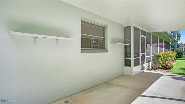 a view of a house with a potted plant and a window
