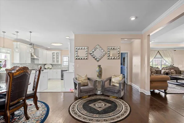 a living room with furniture and next to a window
