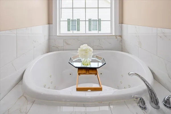 a bathroom with a granite countertop toilet a sink and a mirror