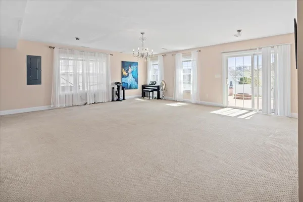a bedroom with a bed a table and a dresser