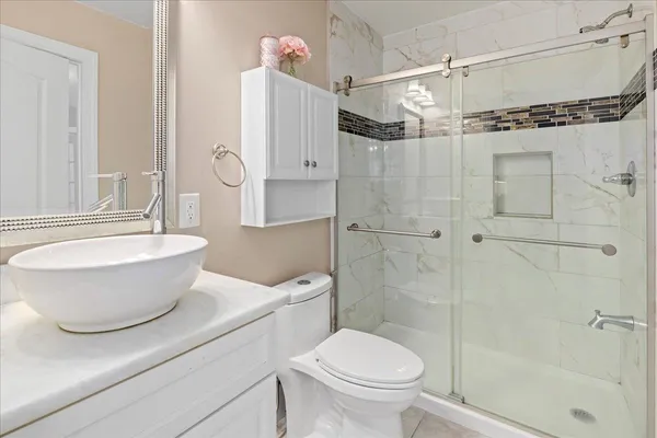 view of a bathroom with a sink and a mirror
