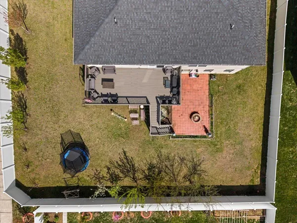 an aerial view of a house with a swimming pool
