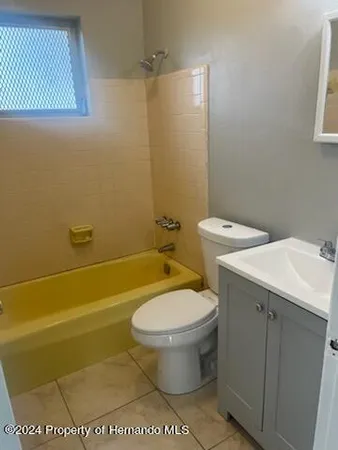 a bathroom with a toilet and a sink