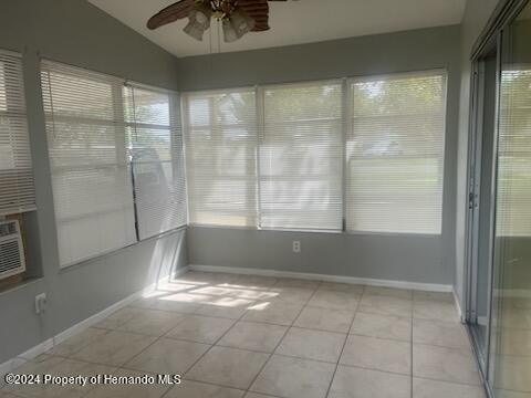 7054 Fireside Street Spring Hill, FL 34606 - Photo 13 of 17 a view of an empty room with a window