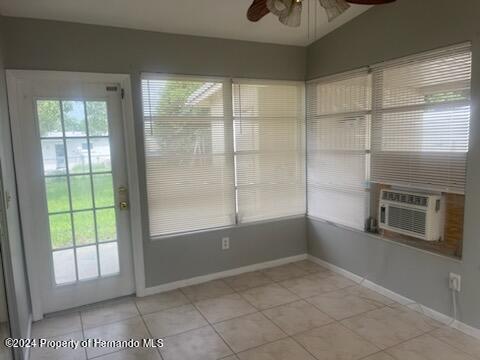 7054 Fireside Street Spring Hill, FL 34606 - Photo 15 of 17 a view of an empty room with a window