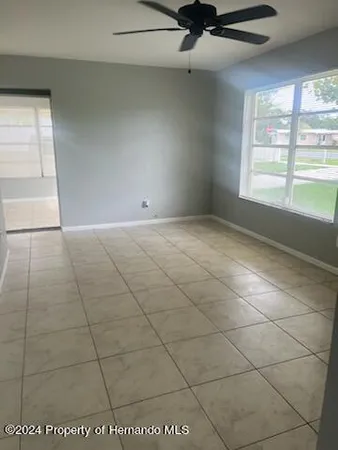 a view of an empty room and a window