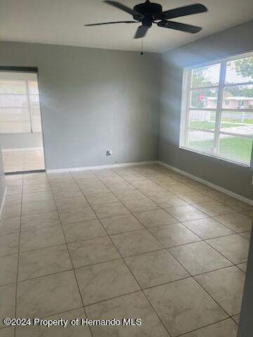 7054 Fireside Street Spring Hill, FL 34606 - Photo 17 of 17 a view of an empty room and a window