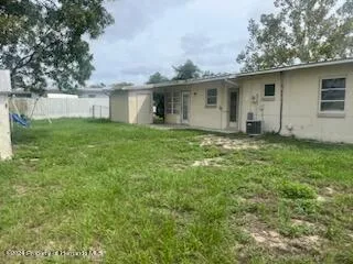 a view of a house with yard and a garden