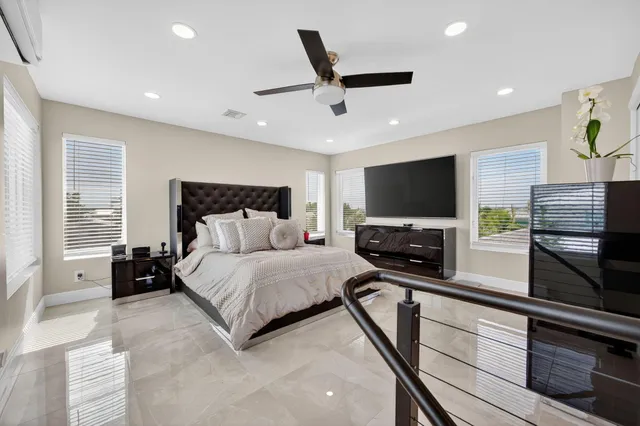 a bathroom with a granite countertop sink mirror and shower
