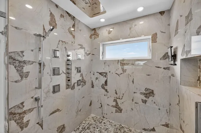 a white toilet sitting next to a bathroom sink
