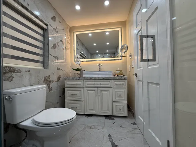a view of a patio with table and chairs and potted plants