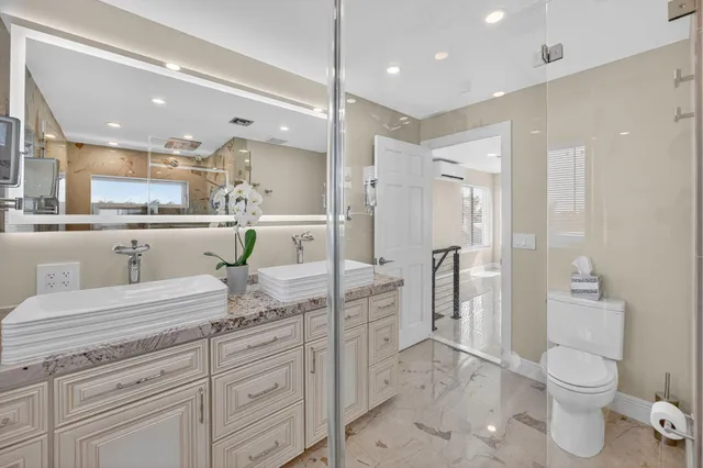 a view of a patio with furniture and wooden floor