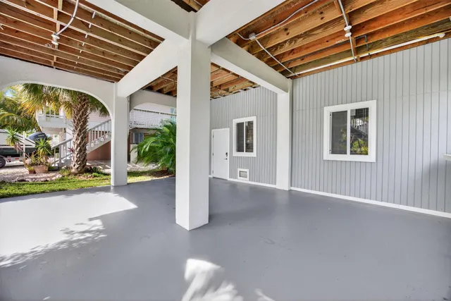 an aerial view of a house with a lake view