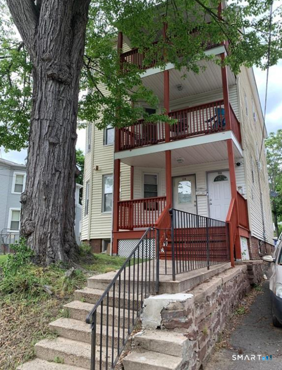 314 Capen Street, Unit 2 Hartford, CT 06112 - Photo 1 of 1 a view of a house with a iron gate