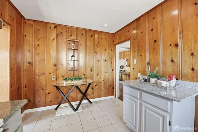 a view of room with furniture and large window