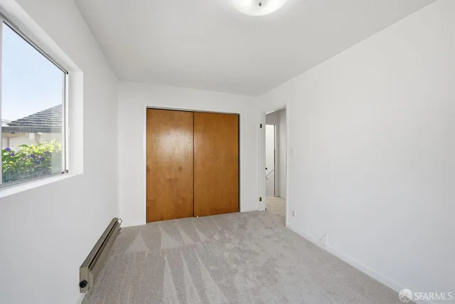 a view of an empty room and window