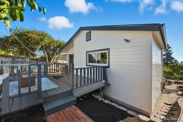 a view of a backyard with a deck