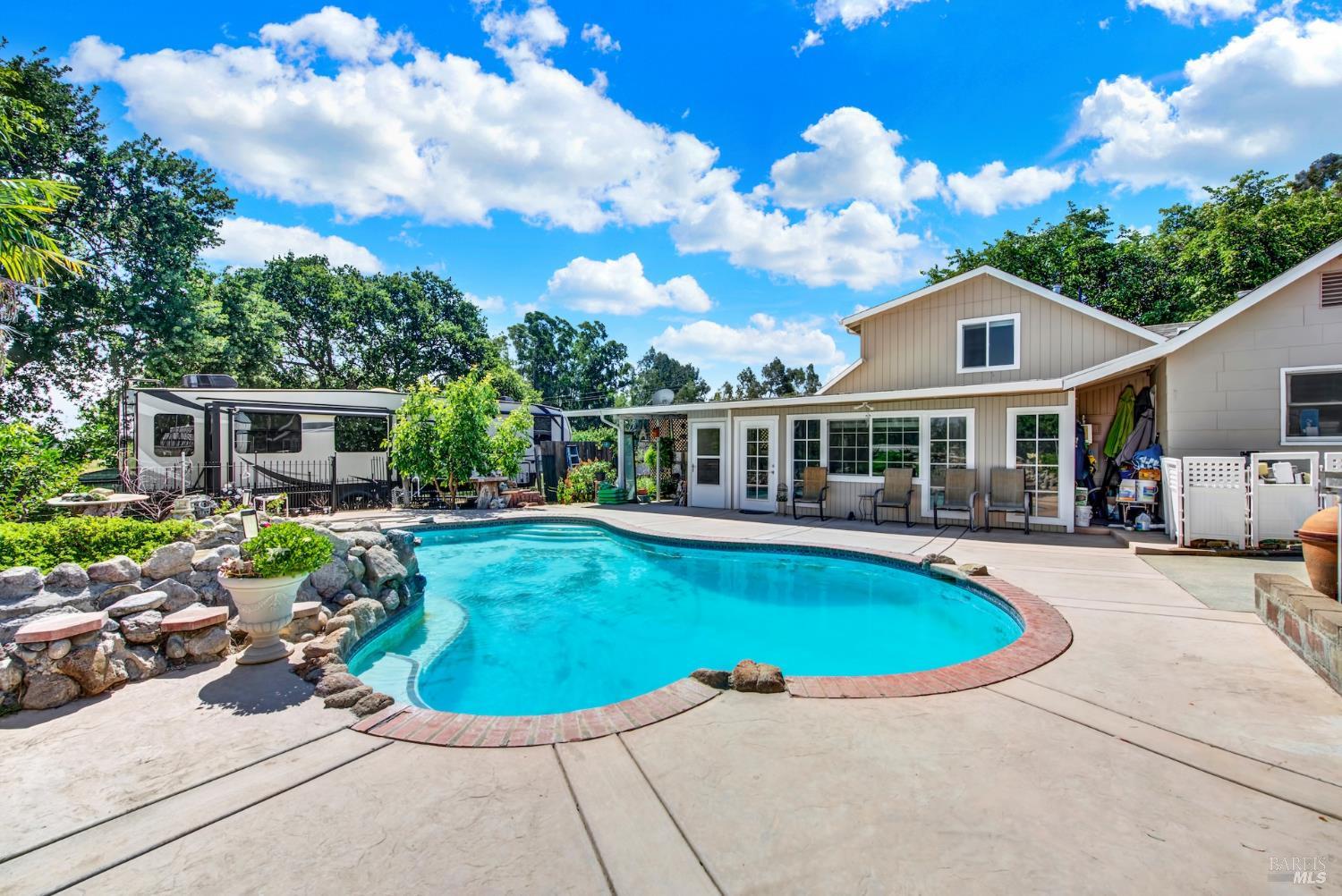 4851 Udell Road Vacaville, CA 95688 - Photo 4 of 65 a view of a house with swimming pool and sitting area