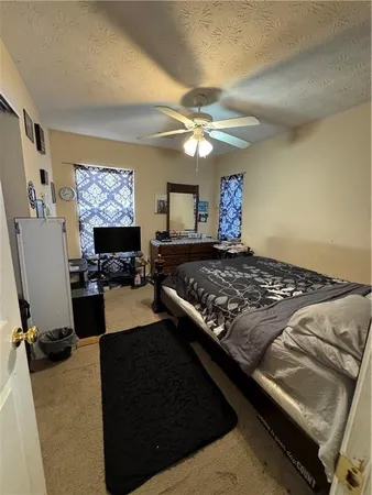 a living room with furniture flat screen tv and a fireplace