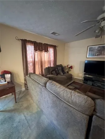 a bed room with furniture and a window