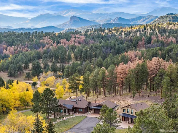 a view of a city with mountains in the background
