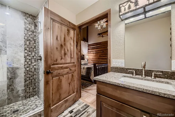 a kitchen with a refrigerator sink and cabinets