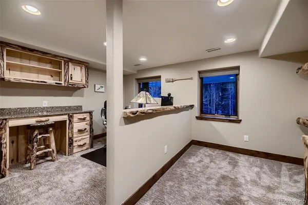 a big room with closet and a chandelier