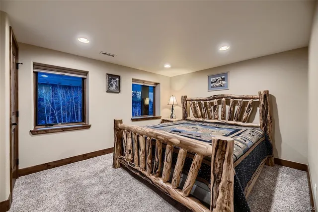 a living room with furniture ceiling fan and a rug