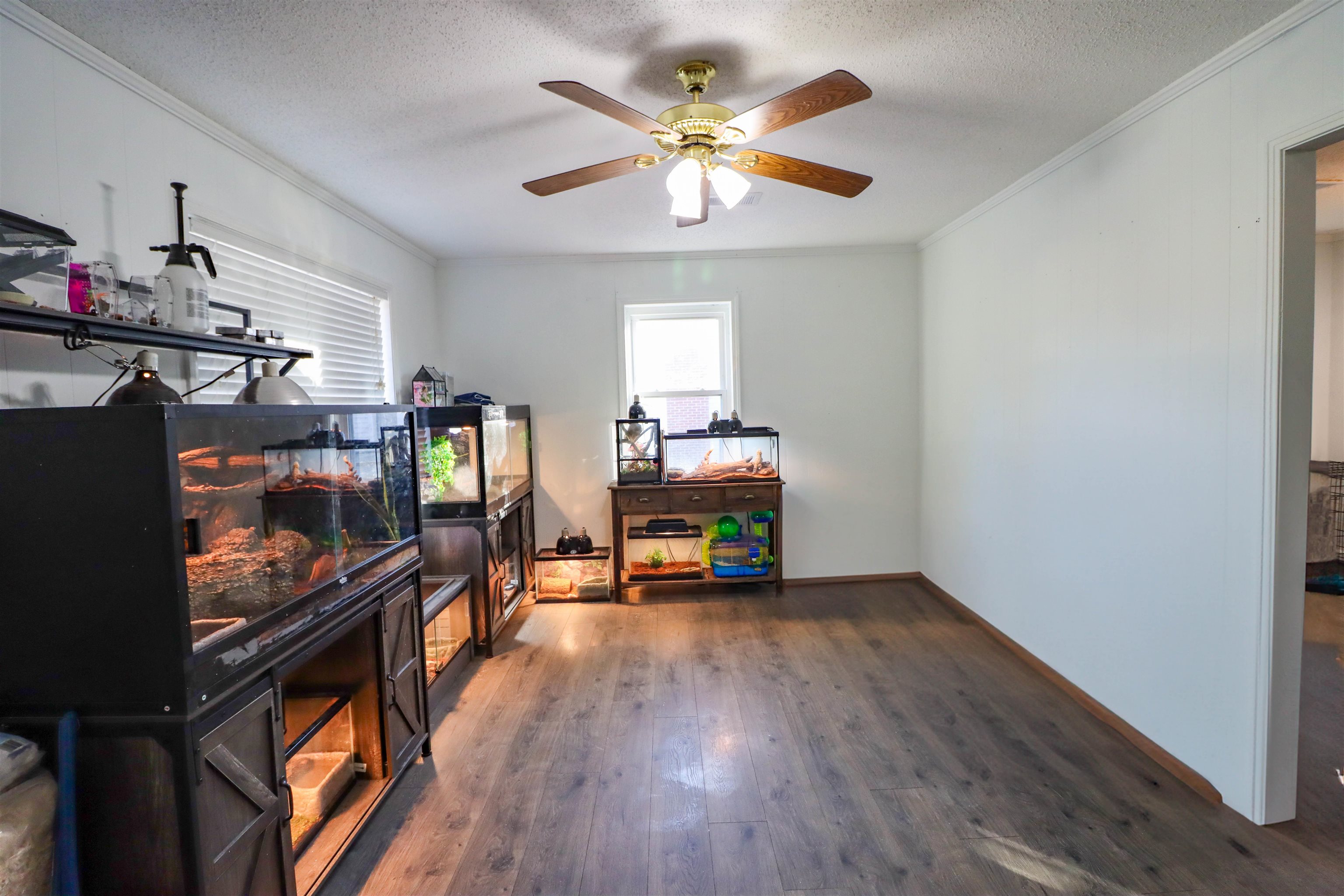 211 Washington Street Newbern, TN 38059 - Photo 18 of 28 a living room with furniture and a flat screen tv with kitchen view